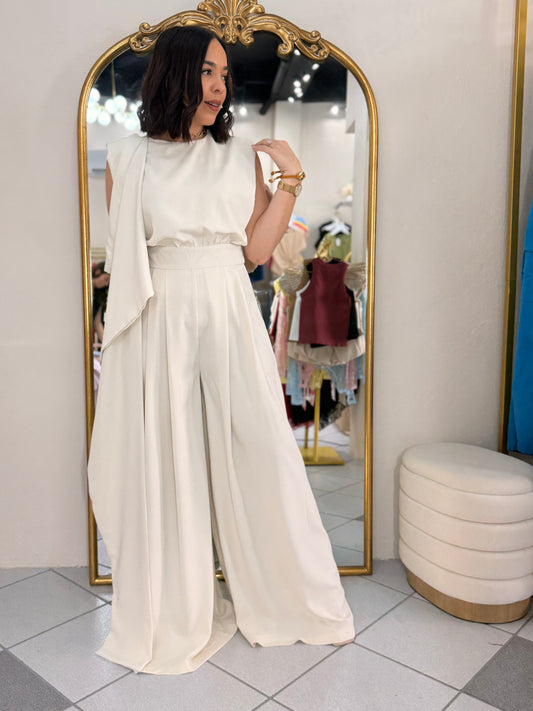 IN BEIGE JUMPSUIT ELEGANTE
