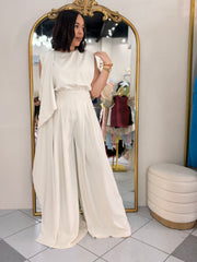 IN BEIGE JUMPSUIT ELEGANTE