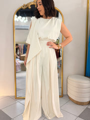 IN BEIGE JUMPSUIT ELEGANTE