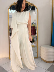 IN BEIGE JUMPSUIT ELEGANTE